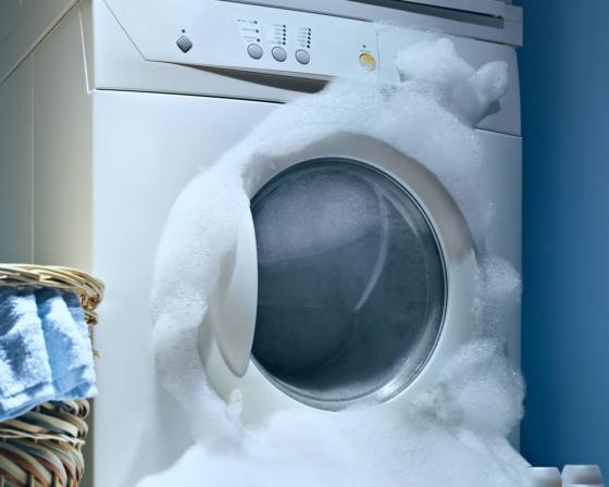 What causes excessive suds in washing machine?